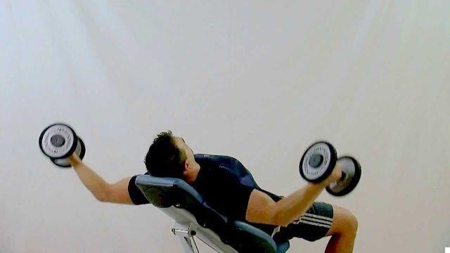 Crosses on incline bench with dumbbells